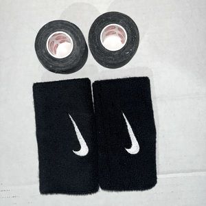 Two Nike wrist bands and two rolls of kinetic tape NWOT